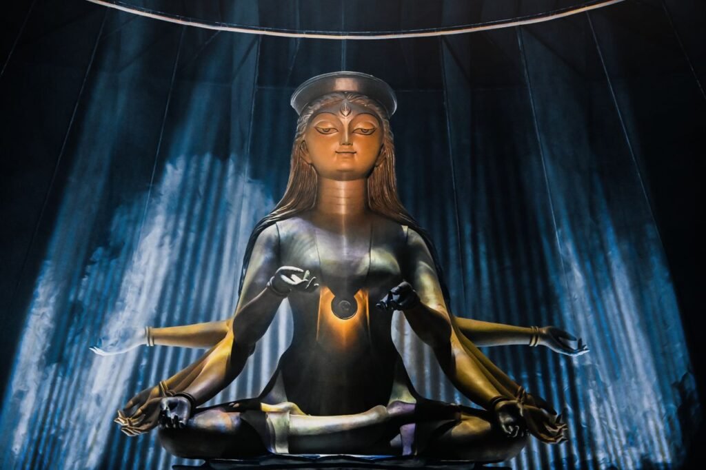A stunning Durga idol captured under dramatic lighting during Durga Puja in Kolkata, India.
